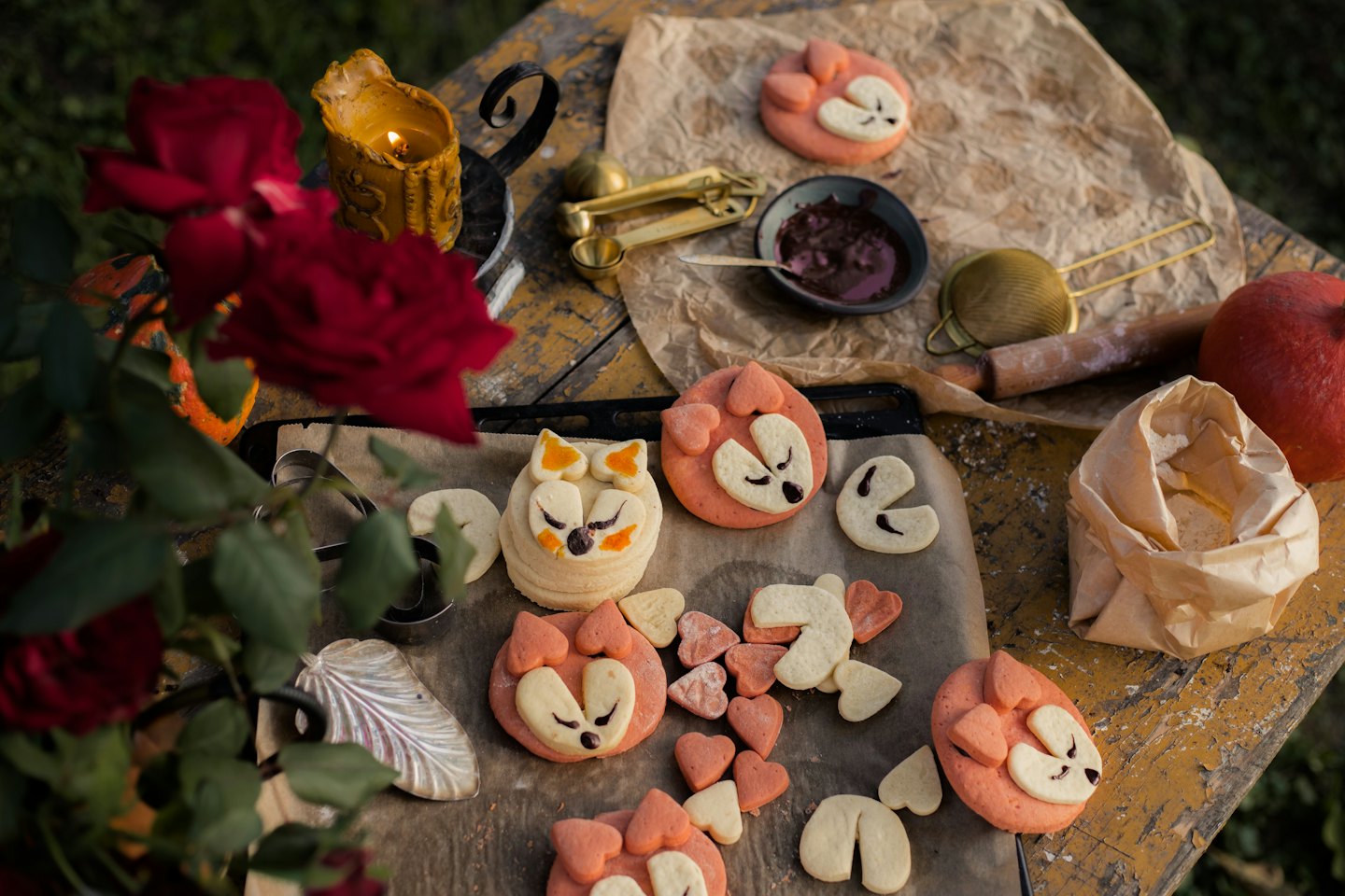 Animal and heart-shaped cookies on a baking sheet.